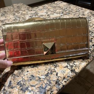 Mk gold cross body handbag.  Elegant.